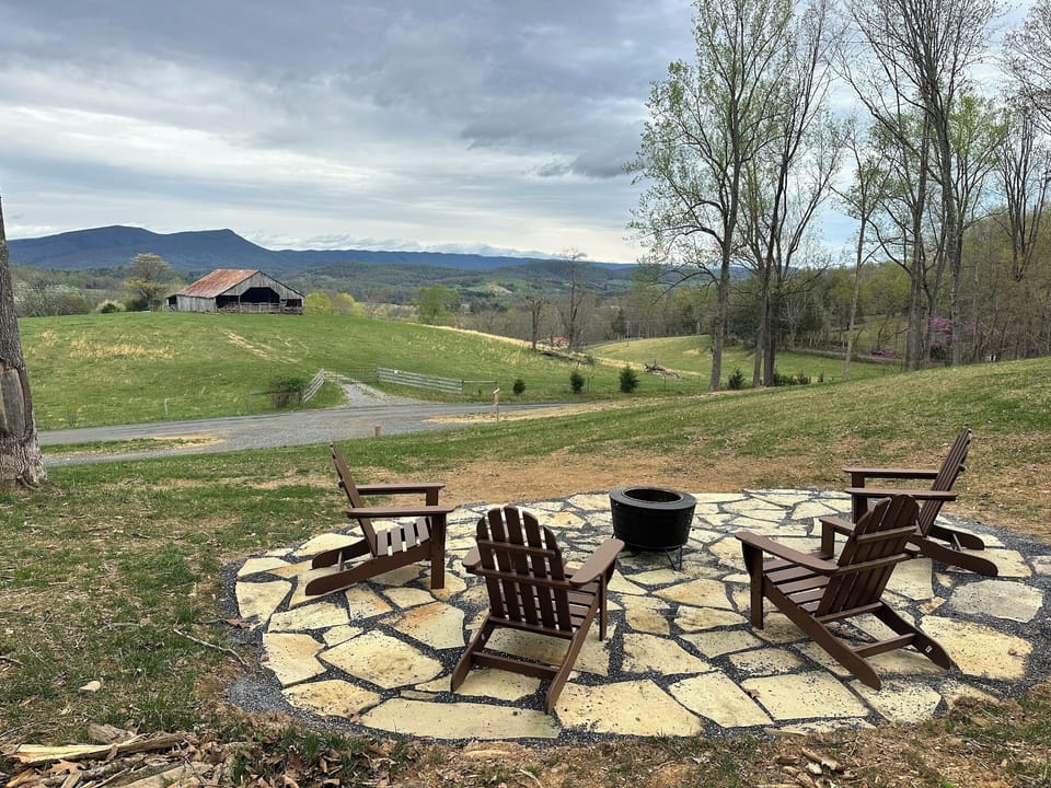 smokeless fire pit with 4 Adirondack chairs