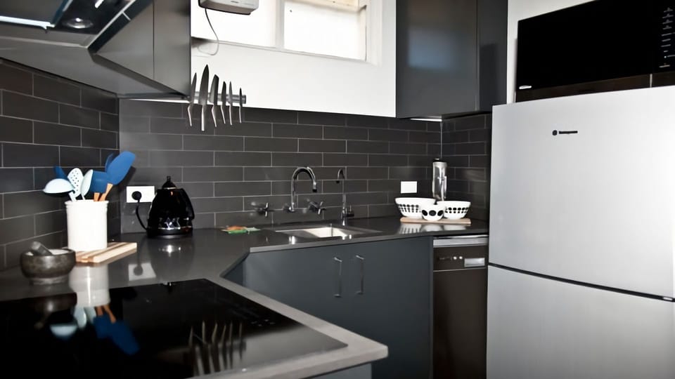Sleek, modern, and perfectly functional. Discover the minimalist charm and efficient design of this kitchen
