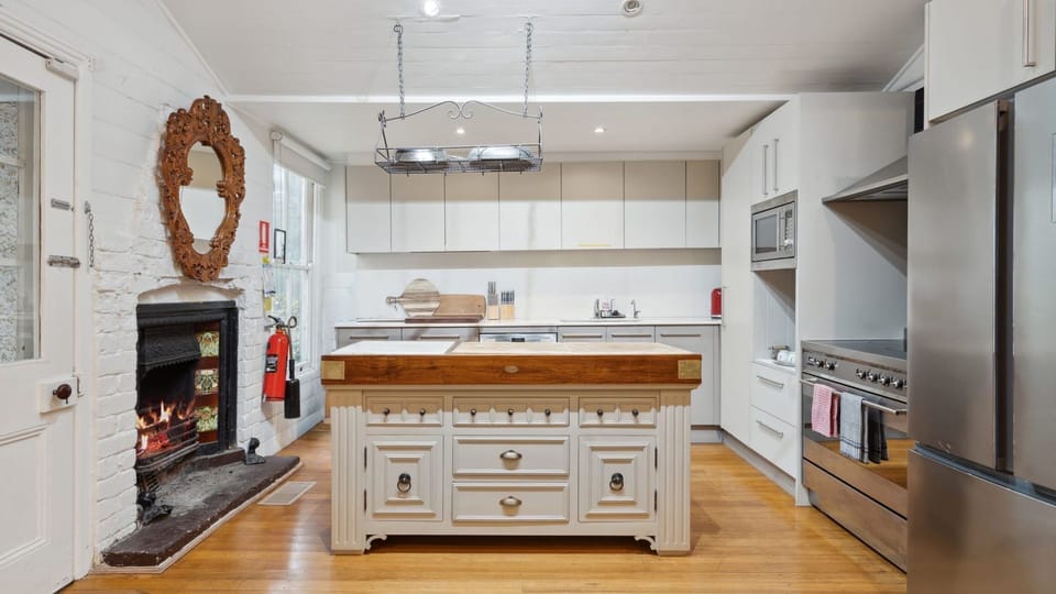 Where the fireplace meets the kitchen island.