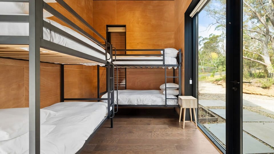 Bedroom with two bunk beds, perfect for kids or group stays.