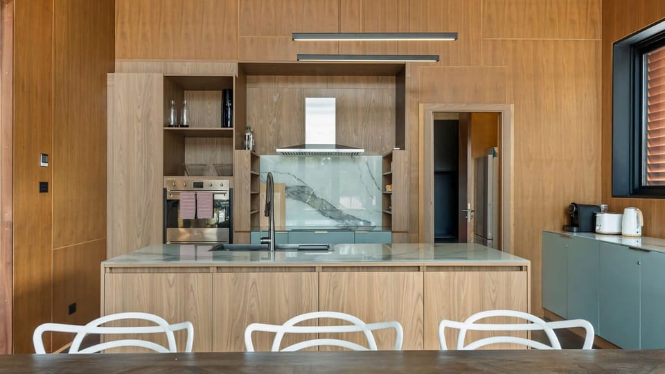Open kitchen design that flows seamlessly into the dining and living areas.