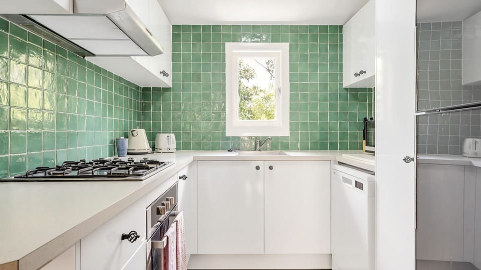  Loving the clean lines and energetic color palette of this modern kitchen space.