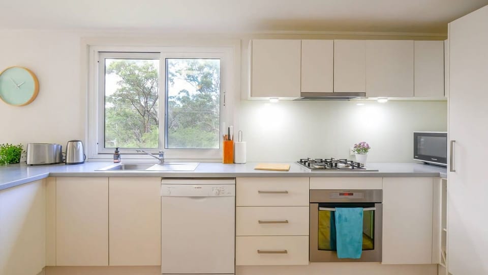 Prepare your favorite meals in this modern, sunlit kitchen, fully equipped for your convenience and ease during your stay