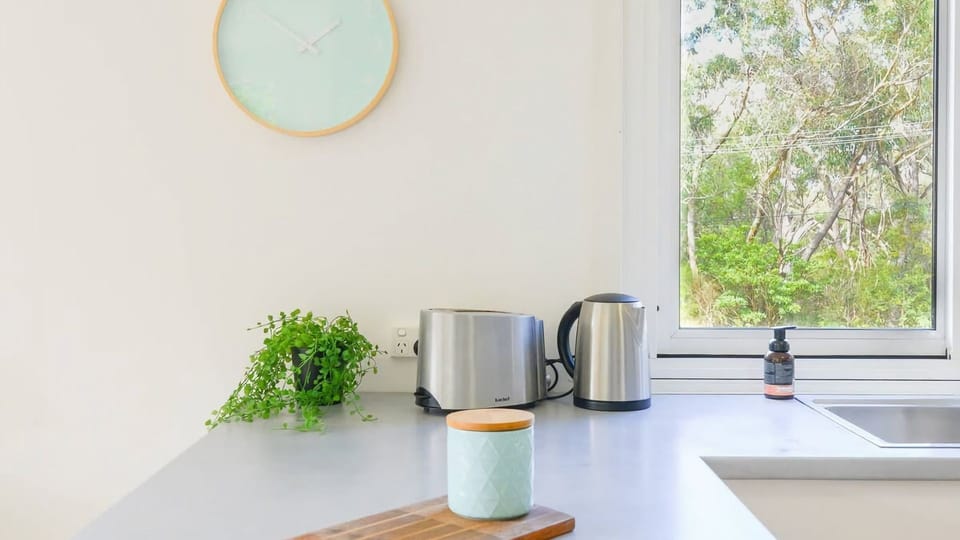 Start your day with ease in this bright, functional kitchen space, equipped with everything you need for a relaxing morning