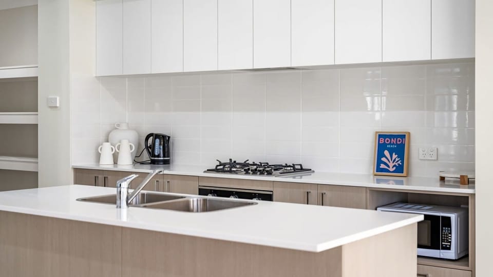 Bright and functional open-plan kitchen perfect for family meals.