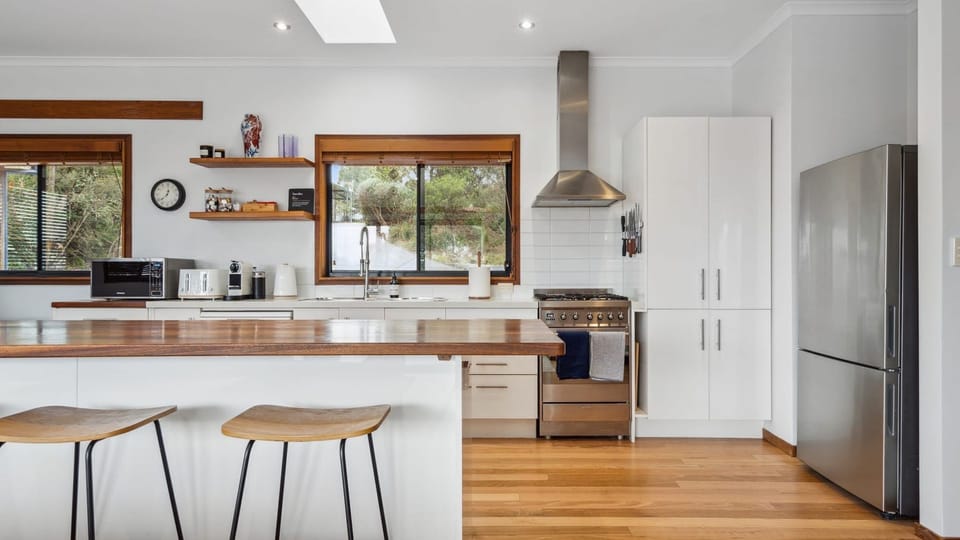 Fully equipped kitchen with modern appliances.