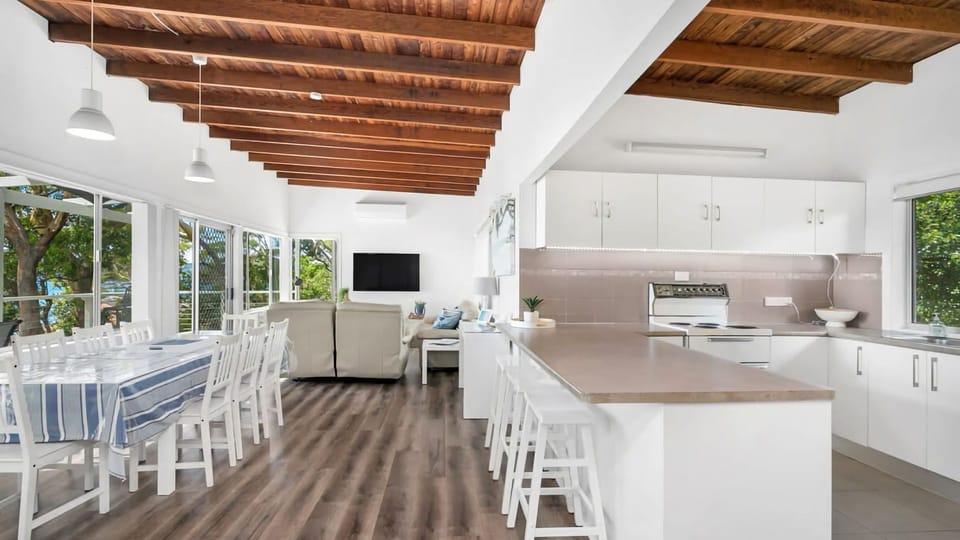 Open-plan living meets coastal charm with a light-filled kitchen and lounge.
