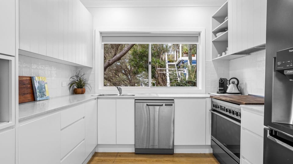 Cook, sip, and savor in this bright kitchen.