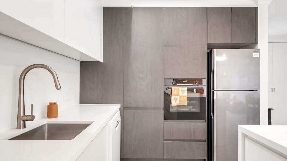 Fully equipped kitchen with sleek finishes and everything needed for easy cooking.