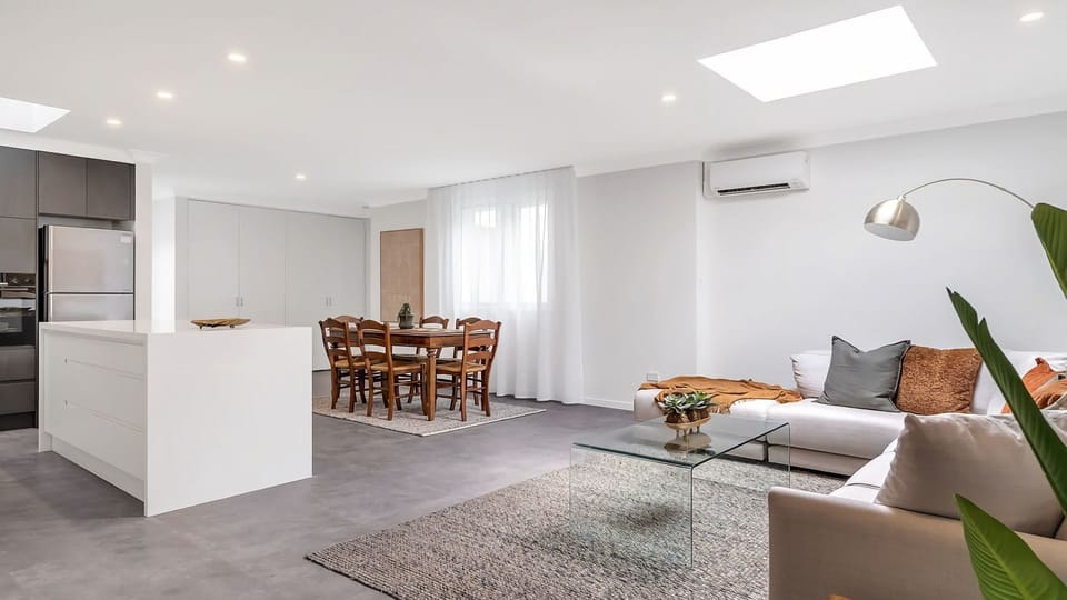 Stylish open plan living and dining area designed for comfort and relaxation.