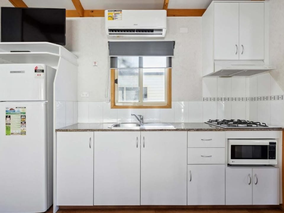 Standard Balcony 2 Bedroom Cabin | Private kitchen | Microwave, stovetop, toaster, cookware/dishes/utensils