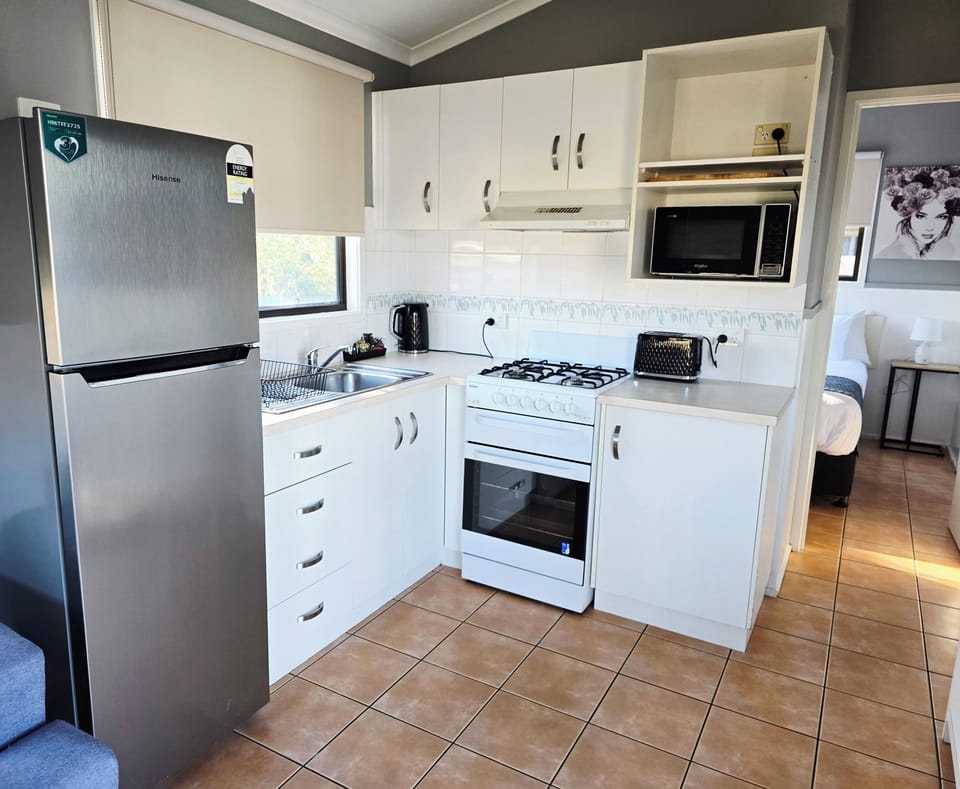 Economy 2 Bedroom Cabin | Private kitchen | Full-size fridge, microwave, stovetop, electric kettle