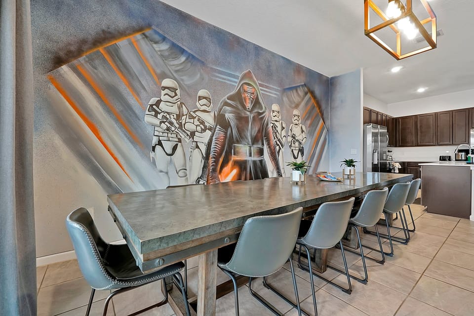 Large dining table with seating for 10 and custom Star Wars wall art
