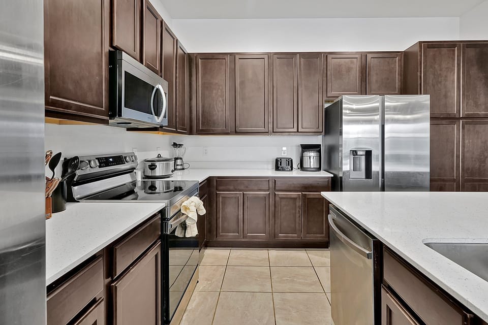 Modern stainless steel appliances and plenty of counter space for group meals