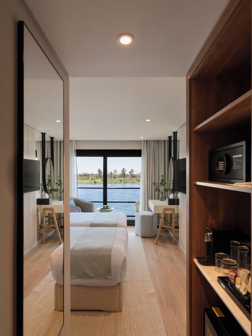 Deluxe Double or Twin Room, River View | Minibar, in-room safe, iron/ironing board, free WiFi