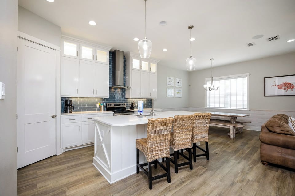 Your open-concept kitchen flows into a cozy dining and living space, perfect for gathering with loved ones over home-cooked meals.