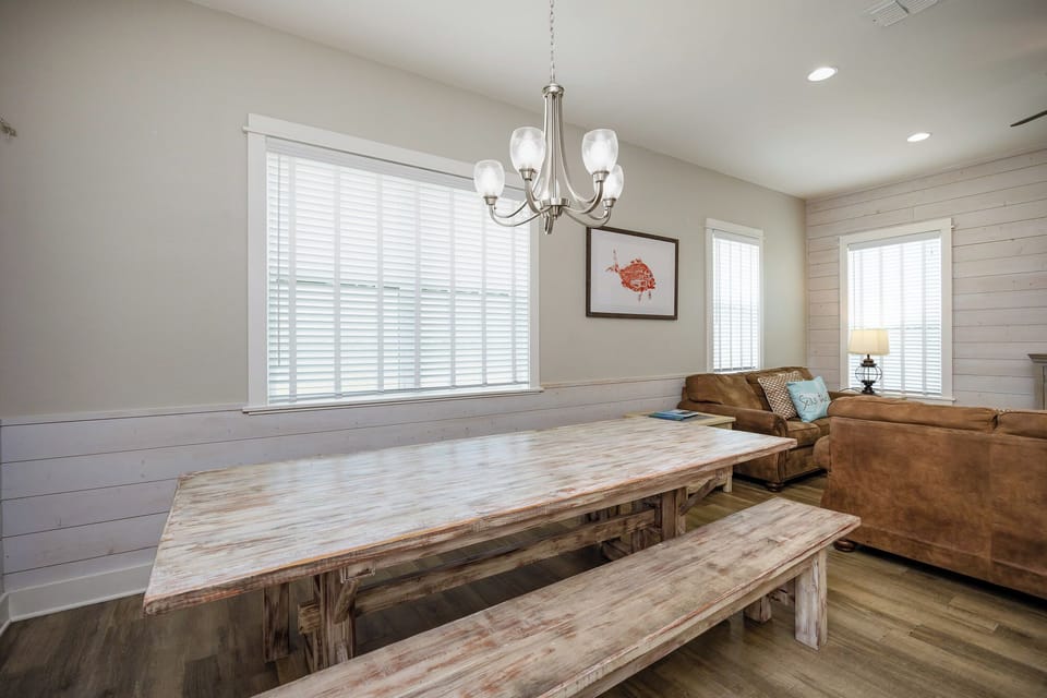 Gather around your rustic dining table for memorable meals, with cozy seating nearby for post-dinner relaxation.