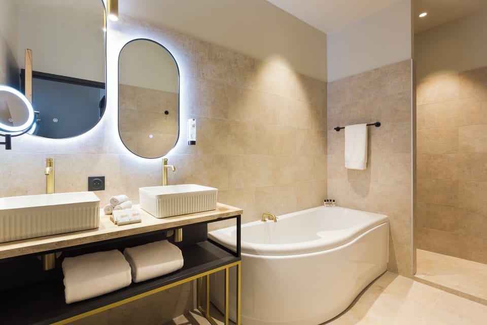 Separate tub and shower, hair dryer, bathrobes, towels