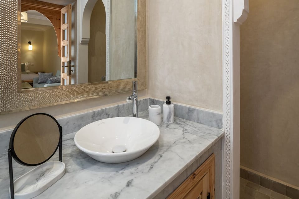 Shower, hair dryer, slippers, towels
