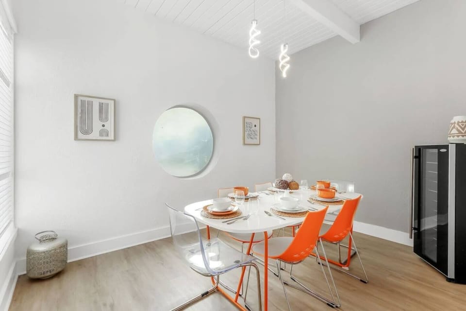 Gather around this spacious 6-person dining table, perfect for enjoying meals and making memories in a warm and inviting setting.