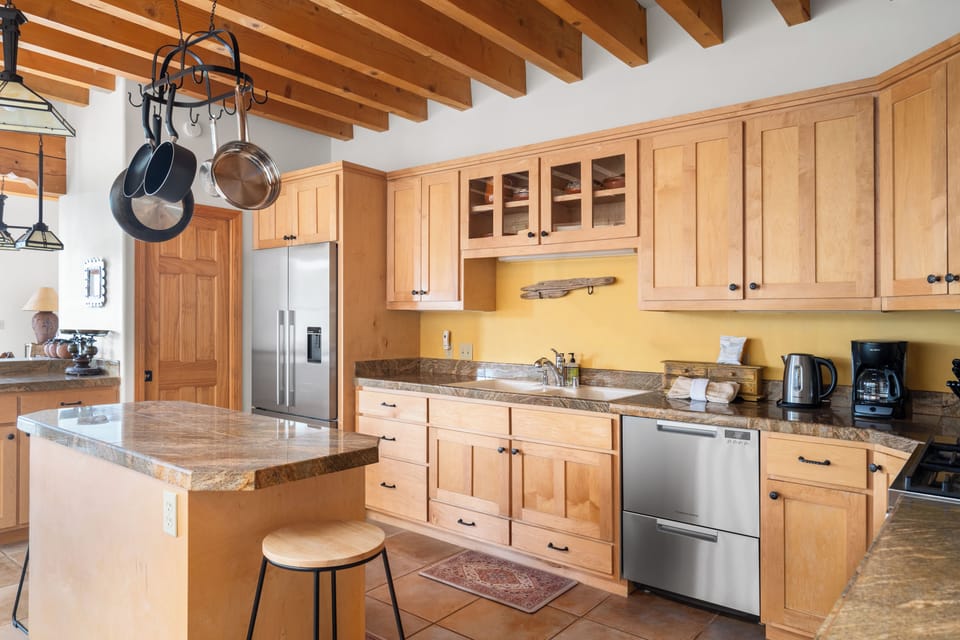 Cook's kitchen equipped with Euro style appliance suite.