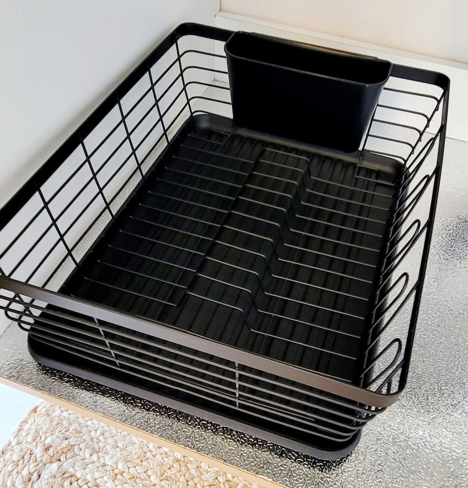 Drying rack beneath the sink.
