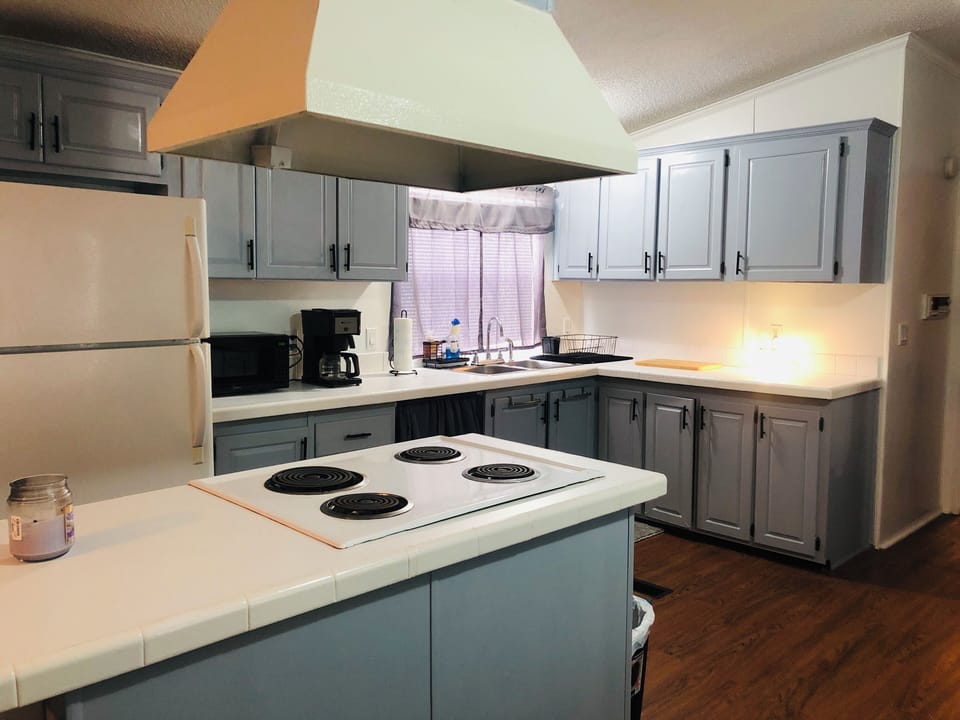 Fully furnished kitchen will cooking and grilling utensils.   