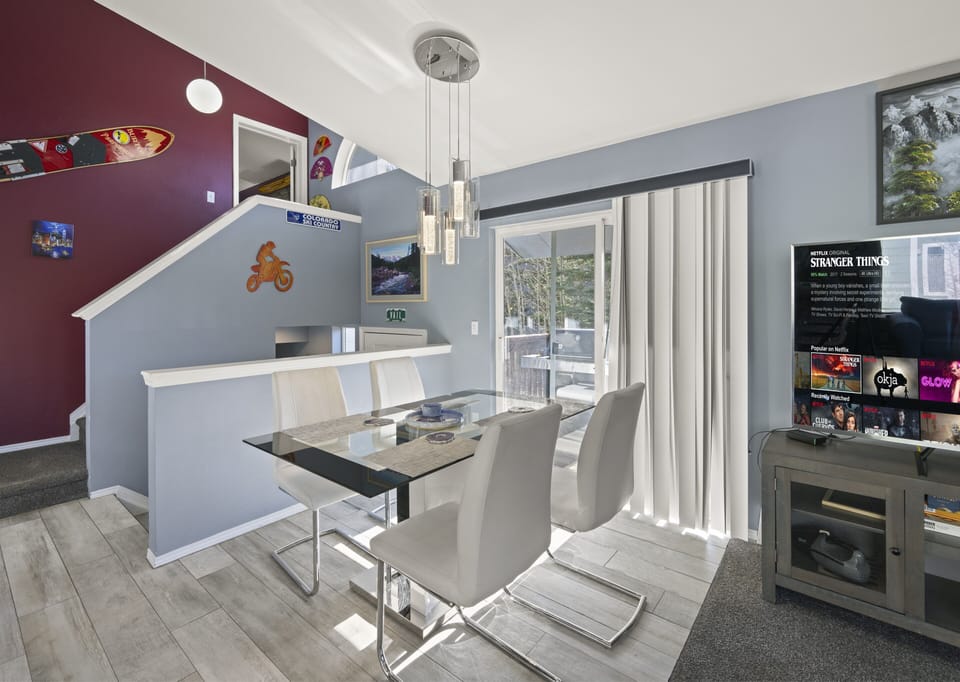 Cozy dining nook with stylish chairs and bright window views.