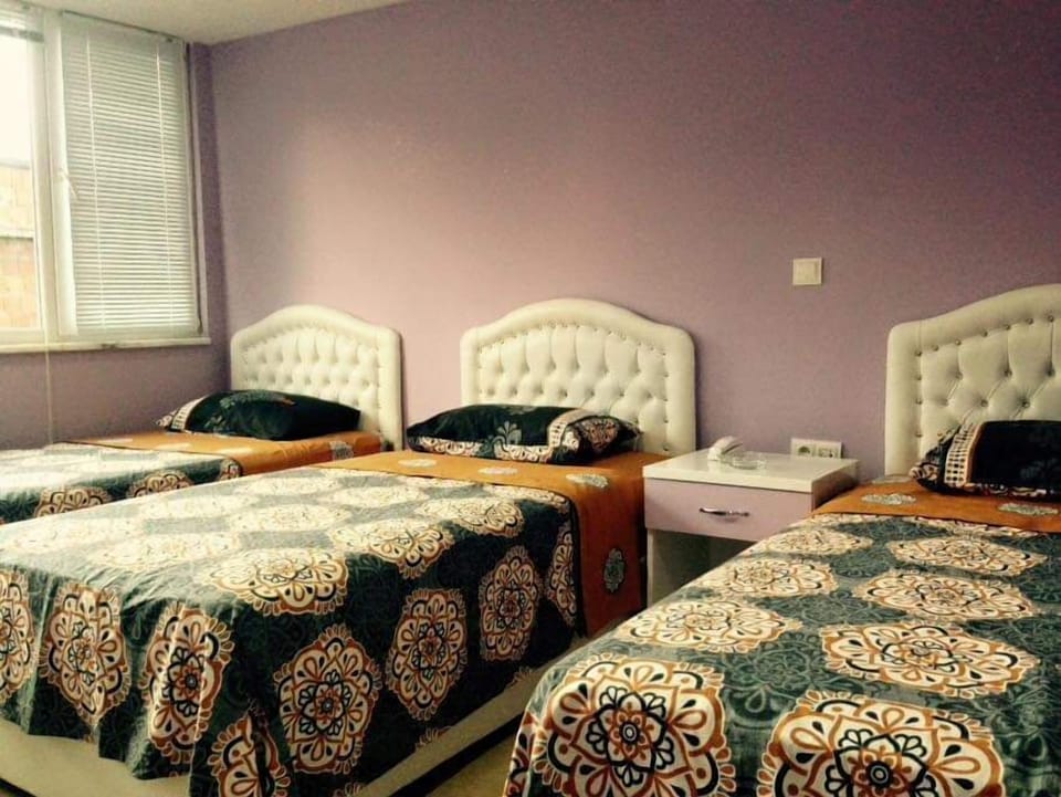 Quadruple Room, City View | Desk, laptop workspace, iron/ironing board, WiFi (free)