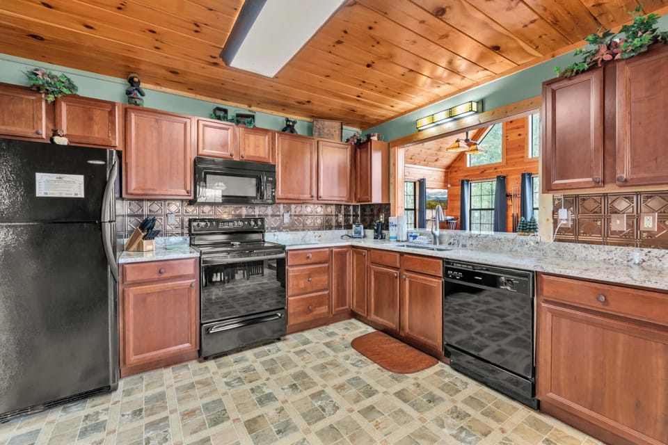 The warm, inviting kitchen offers ample space & all the comforts of home