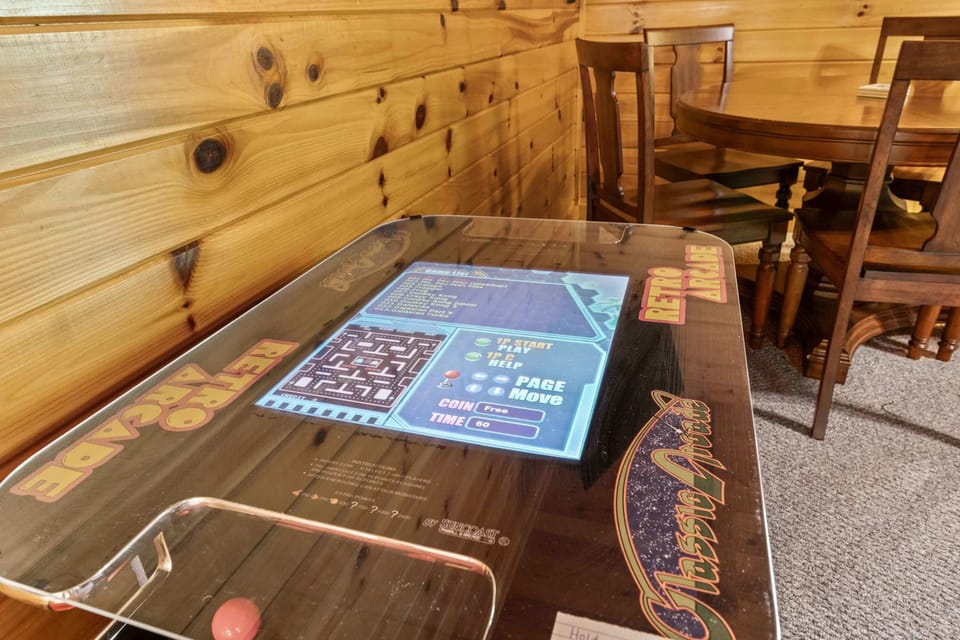 Loft with arcade game, twintwin bunk bed, and queen size futon