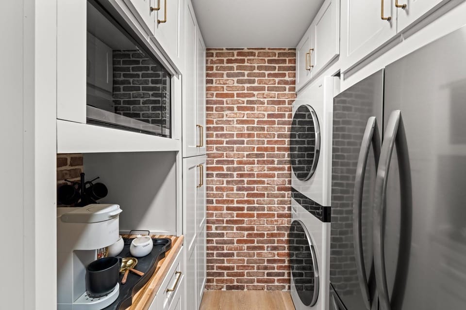 Private laundry is available for your stay, tucked away in the kitchen