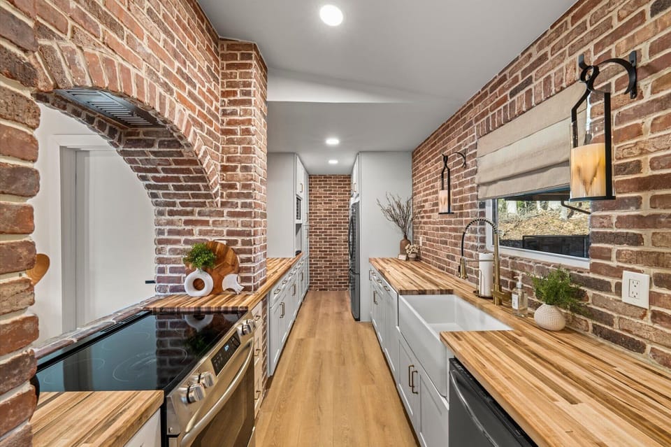 The serene kitchen offers ample space & all the comforts of home