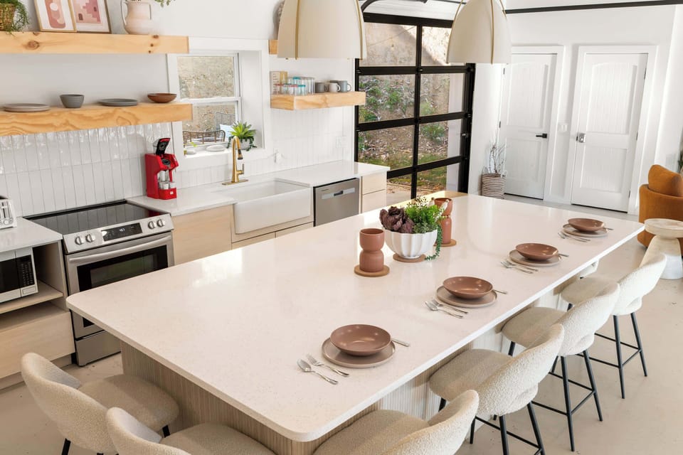 Enjoy mealtimes together at the spacious kitchen island, seating 6