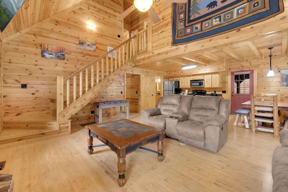 Curl up in the living room & enjoy a movie by the seasonally-available fireplace