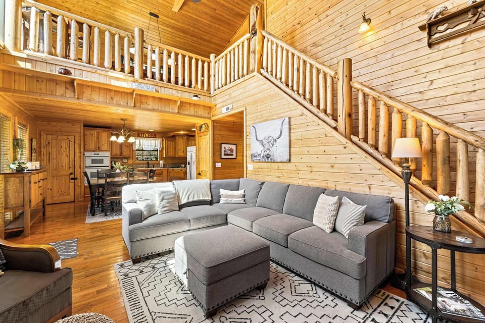 Cozy and spacious living area with TV and fireplace