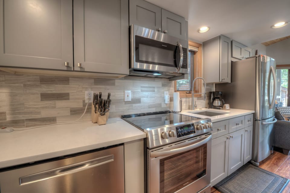 Kitchen with toaster, drip coffee maker, blender, slow cooker and more