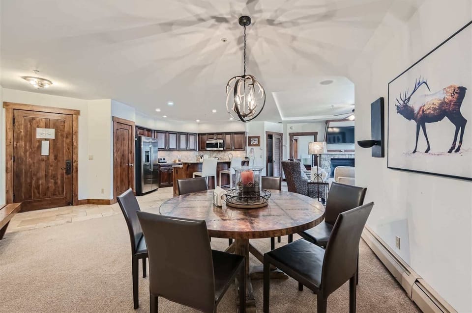 Gather for meals together at the dining table, offering seating for 7