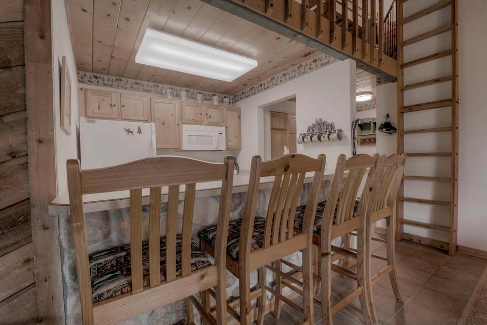 Kitchen with toaster, drip coffee maker, blender, slow cooker, and more