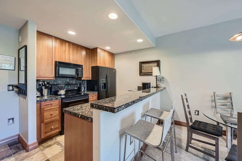 Sip morning coffee or grab a bite at the kitchen counter, seating 2