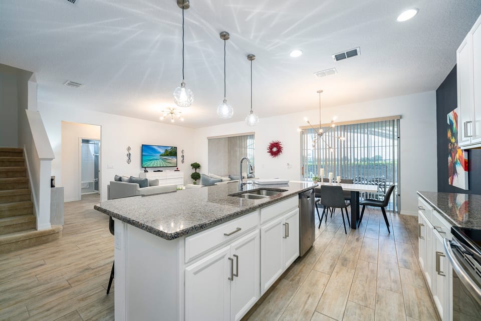 Open floor plan showing kitchen, dining and living rooms