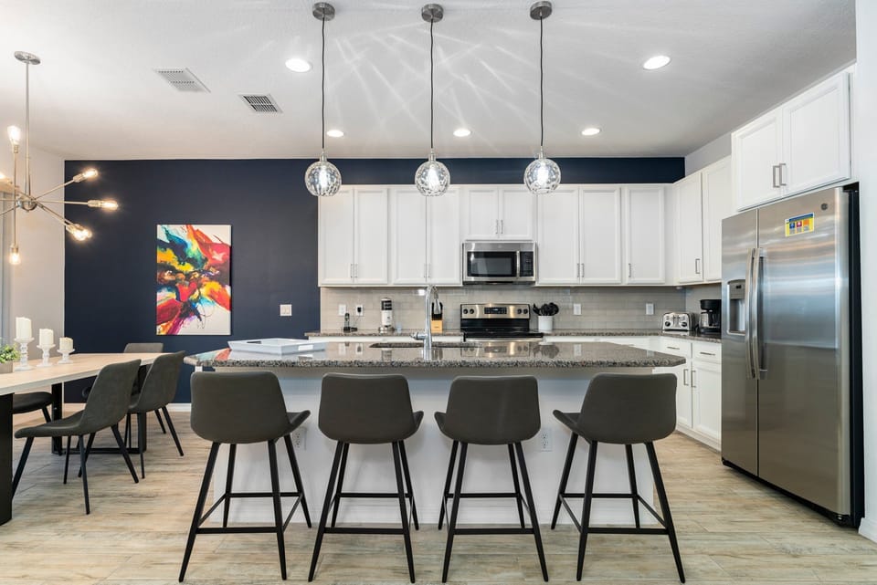 Kitchen showing modern fresh new kitchen and seating for 4 at the breakfast bar.