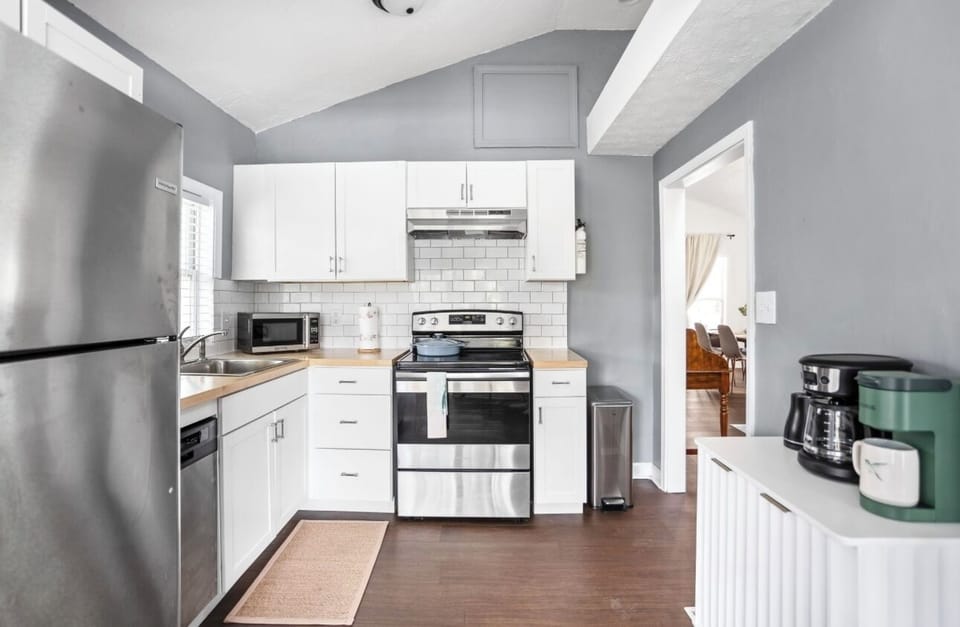 kitchen, stove, coffee maker, microwave, dishwasher, refrigerator. 