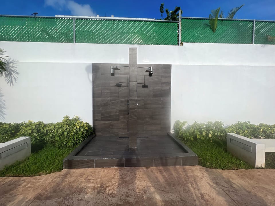 Community pool with outdoor showers
