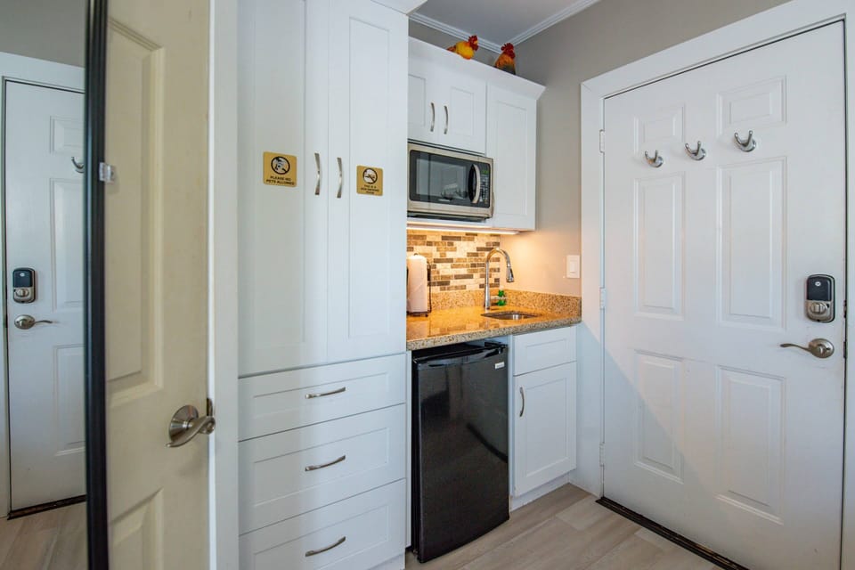 The nicely appointed kitchenette offers convenience and functionality, making it easy to prepare snacks and light meals during your stay.