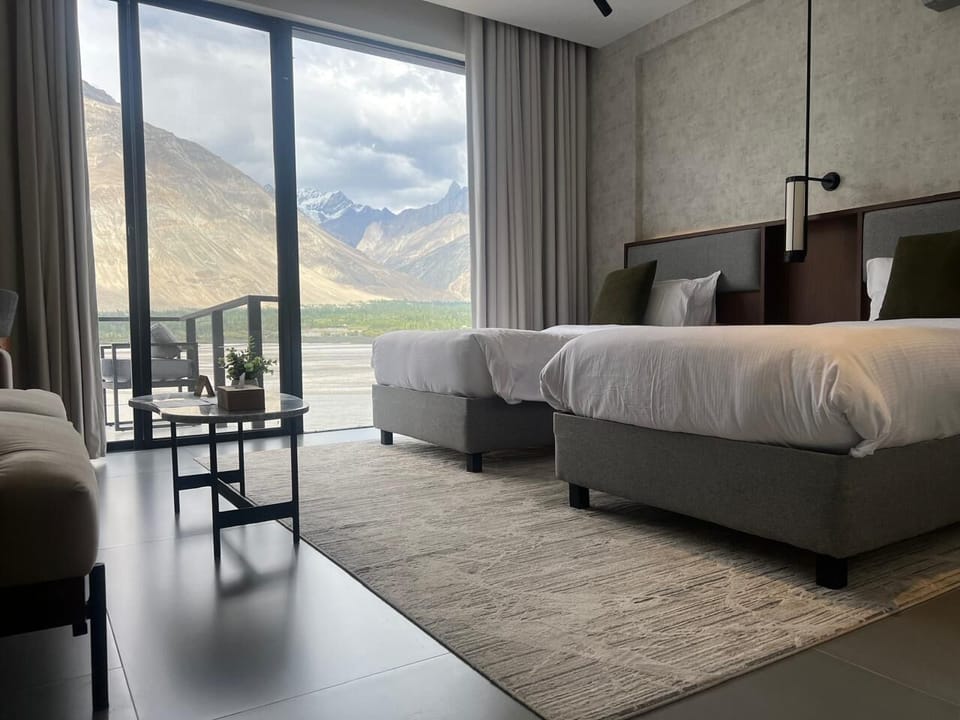 Deluxe Twin Room, 1 Bedroom, River View | Premium bedding, minibar, desk, laptop workspace