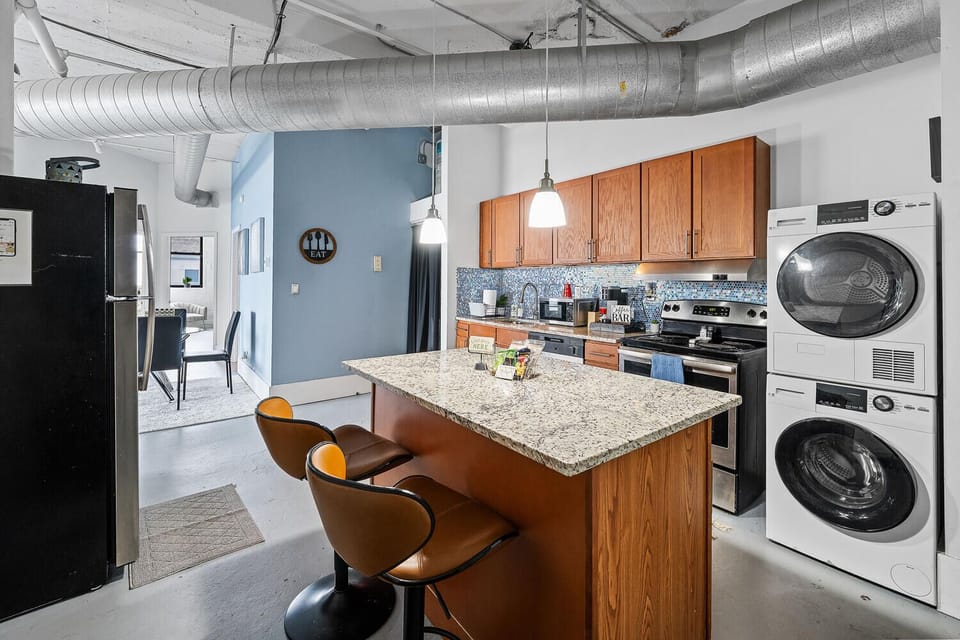 Kitchen area with bar stools