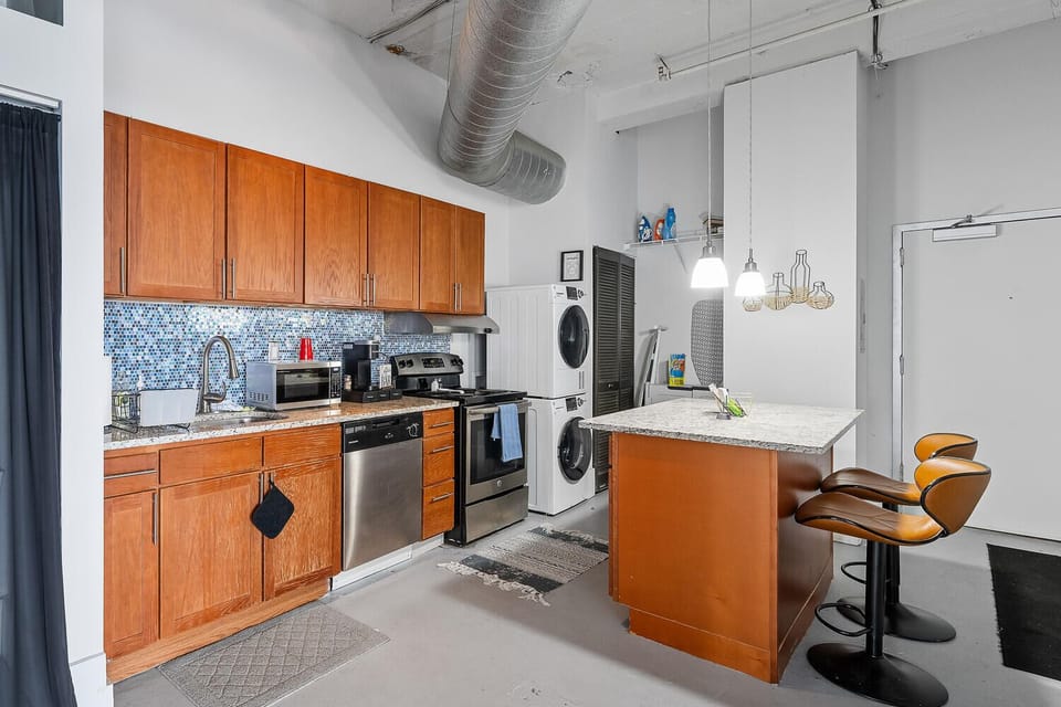 Full kitchen with dishwasher, stove, and refrigerator