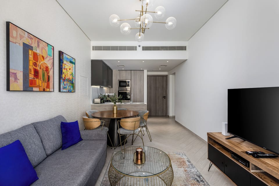Deluxe Apartment, Balcony, City View | Living area | Flat-screen TV