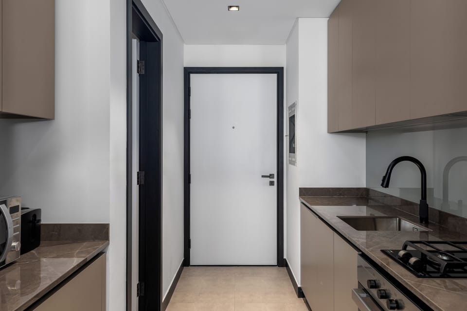 Deluxe Studio, Balcony, City View | Private kitchen | Fridge, microwave, oven, stovetop